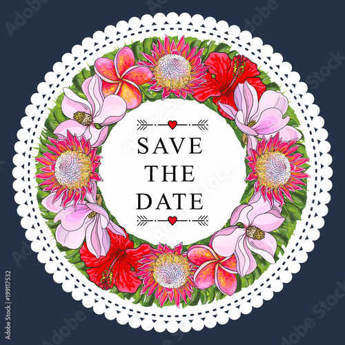 Tropical flowers and palm leaves in floral composition in form of circle with...