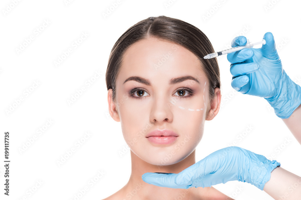 cropped shot of doctor making beauty injection for woman isolated on white