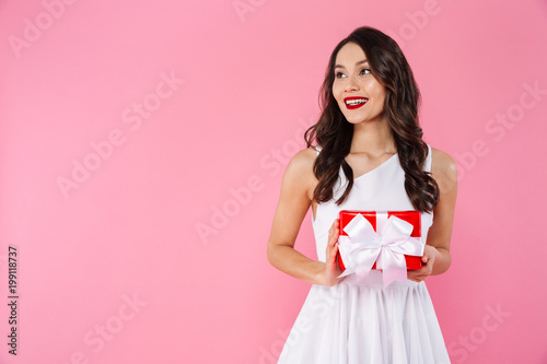 Cute pretty young asian woman holding gift box.