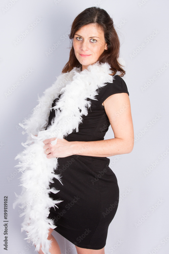 Portrait of young pregnant women with boa on white background Portrait of young pregnant women with boa on white background