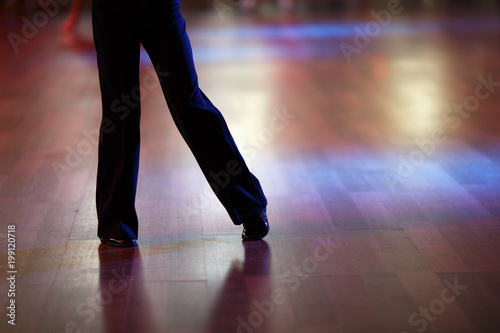 Closeup of dancer's legs as they do the ballroom dance © Vladimir