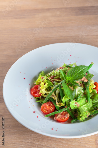 Canned tuna salad with cherry tomatoes, green beans and French mustard