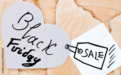 heart on wooden background, inscription on the heart Black Friday