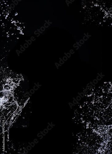Water splash. Isolated on black background.