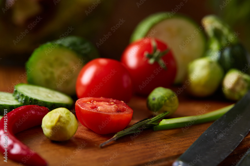 fresh vegetables on the cutting board over wooden background, selective focus, shallow depth of field fresh vegetables on the cutting board over wooden background, selective focus, shallow depth of field