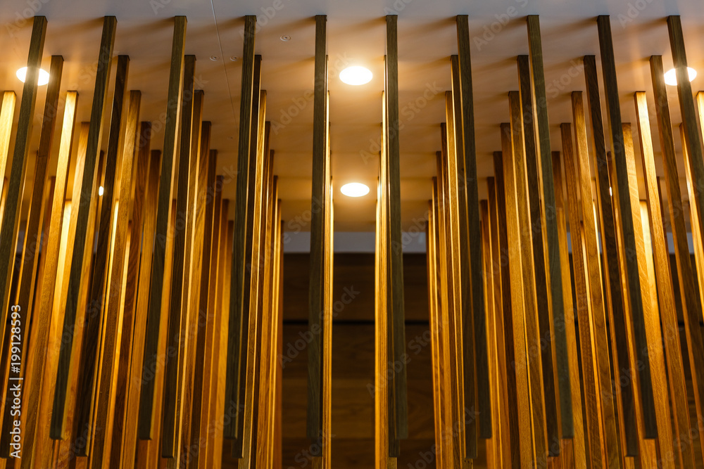 texture of wooden sticks hang from the ceiling at outdoor constructions