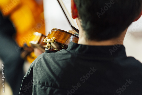 Unrecognizable musician playing violin photo