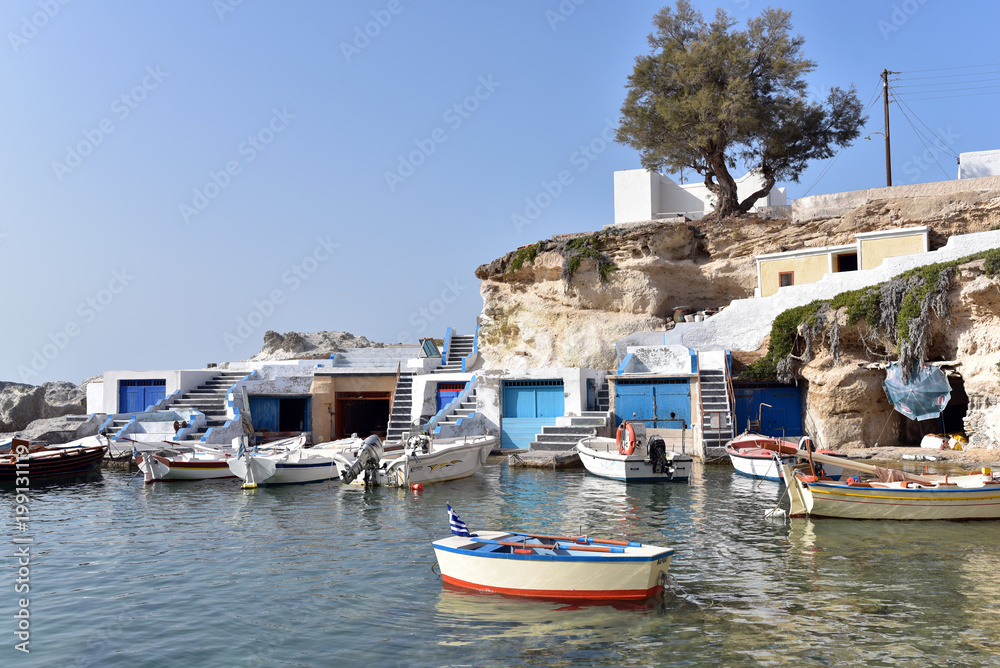 View over fishing harbour with boats and colourful boat houses, Mandrakia, Milos, Cyclades, Greece