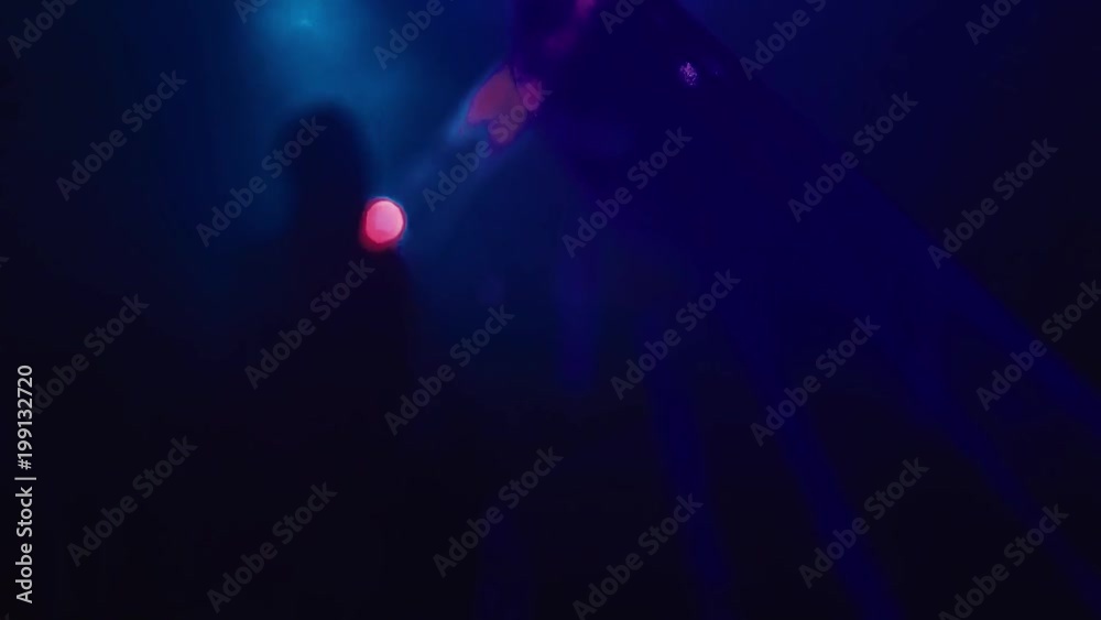 Dancing people on the dance floor. Stroboscope, light of lasers, multi-colored lights Dancing people on the dance floor. Stroboscope, light of lasers, multi-colored lights