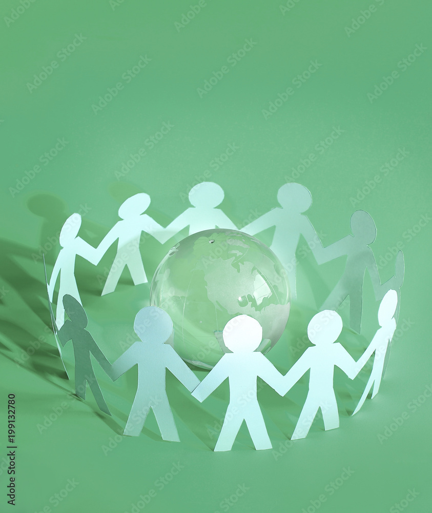 group of paper men standing around the glass globe group of paper men standing around the glass globe