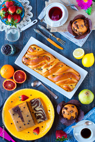 Wallpaper Mural Breakfast with coffee and tea with different pastries and fruits on a wooden table Torontodigital.ca