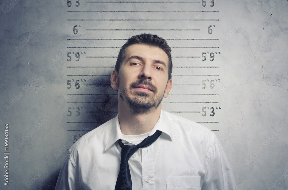 Portrait of a handsome, stylish bearded businessman posing for a mugshot Portrait of a handsome, stylish bearded businessman posing for a mugshot