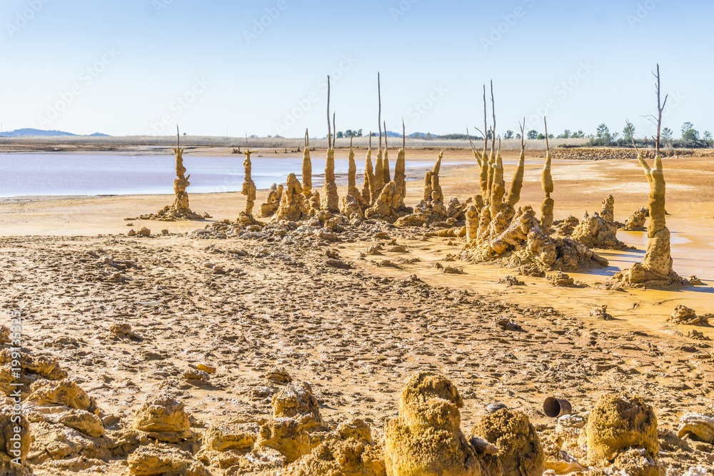 Gossan Reservoir with orange stalagmites on shore, Andalusia, Spain