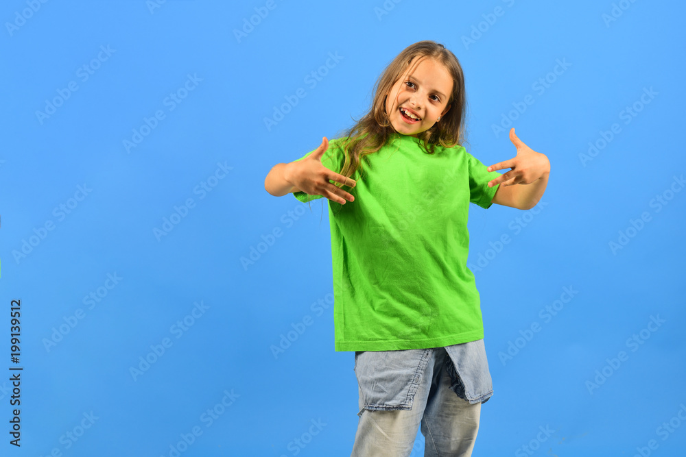 Girl with happy face on blue background, copy space Girl with happy face on blue background, copy space