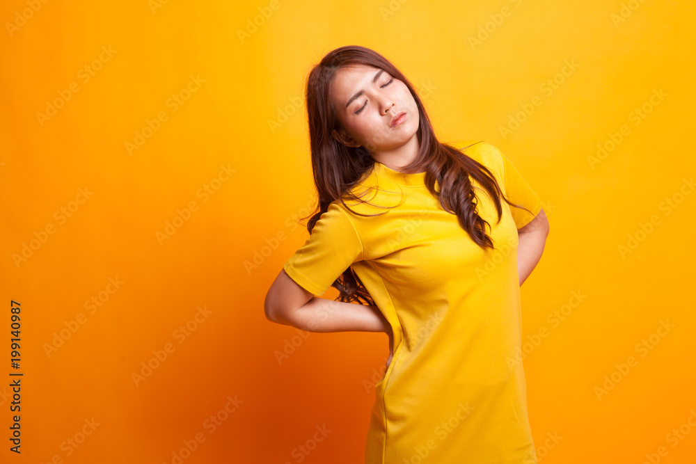 Young Asian woman got back pain. Young Asian woman got back pain.