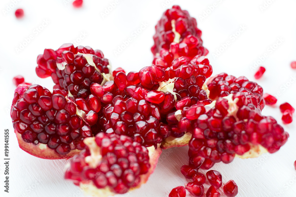 Cut-up dissected garnet fruit pomegranate seeds isolated on white background Cut-up dissected garnet fruit pomegranate seeds isolated on white background