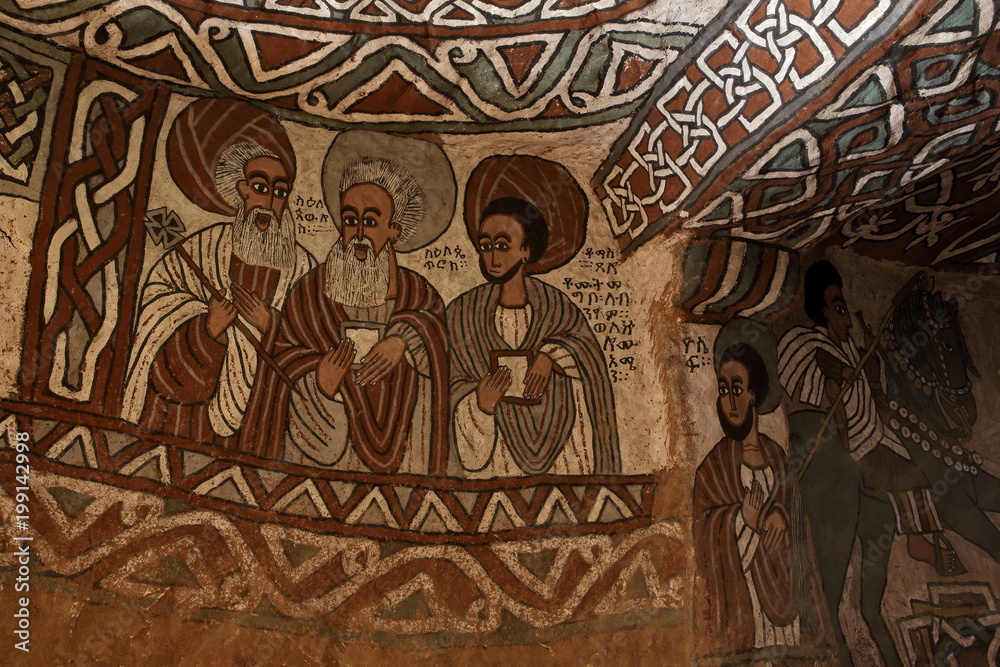 Fototapeta premium wall murals of saints and iconographic scenes, painted in naive african christian style, on wall of Abuna Yemata Guh church 