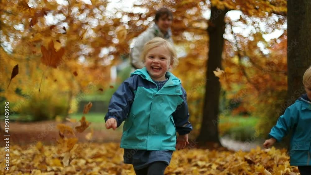 Childhood Moments: Teenager and Children Playing with Autumn Leaves in Park 4 Childhood Moments: Teenager and Children Playing with Autumn Leaves in Park 4