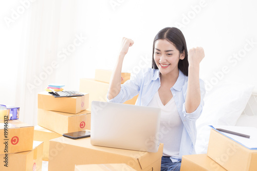 Young Asian Woman success for online business, Young Owner Woman Start up for Business Online. People with online shopping SME entrepreneur or freelance working concept.