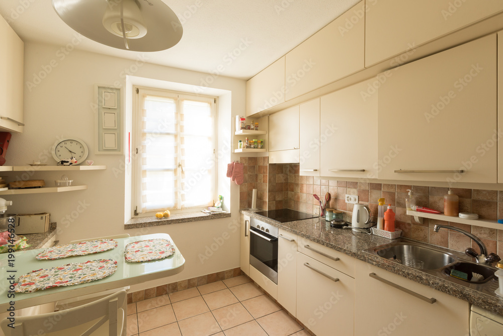 Interiors of modern apartment, kitchen Interiors of modern apartment, kitchen