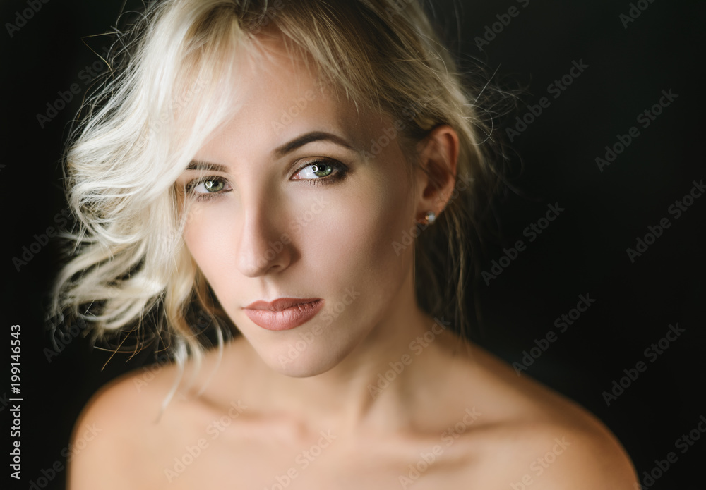 Portrait of beautiful sensual woman with green eyes. Studio shot. Portrait of beautiful sensual woman with green eyes. Studio shot.
