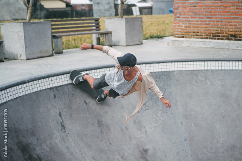 extreme young skater in pool of skatepark