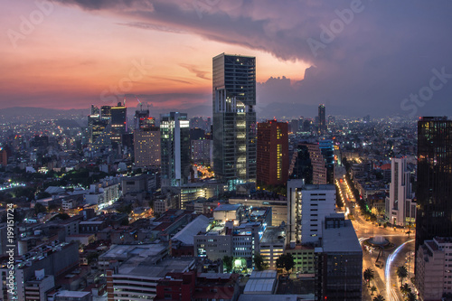 Aerial view of mexico city downtown skyscrappers at sunset time before night. photo