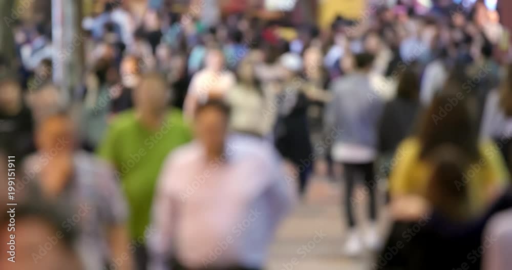 Blur view of Crowded of people walking in the street at night Blur view of Crowded of people walking in the street at night