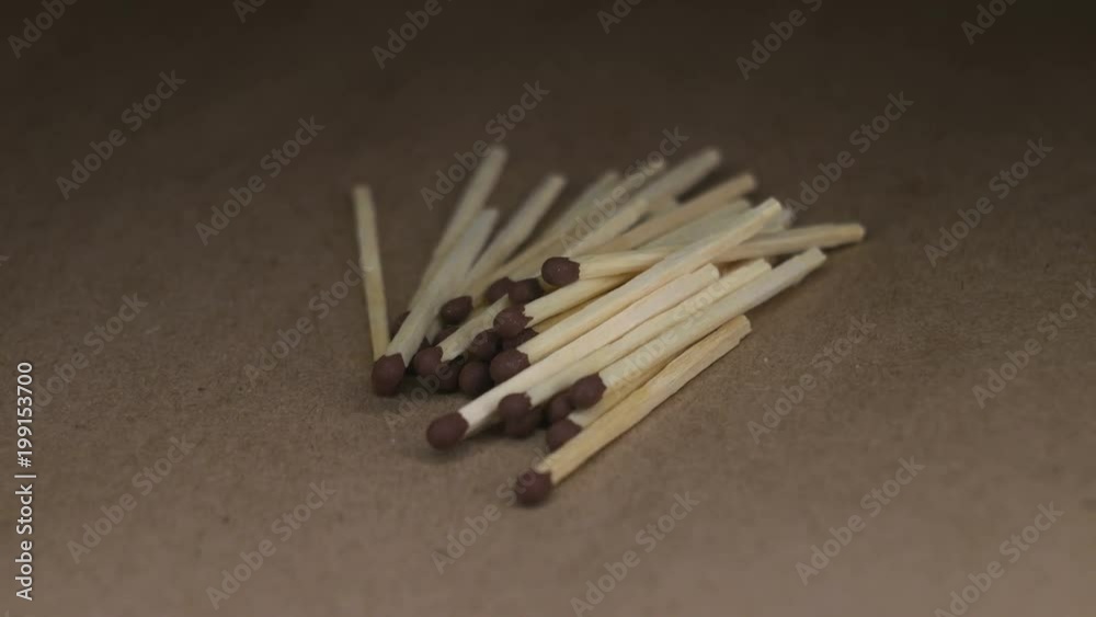 Wooden matches on craft paper rotating table Wooden matches on craft paper rotating table
