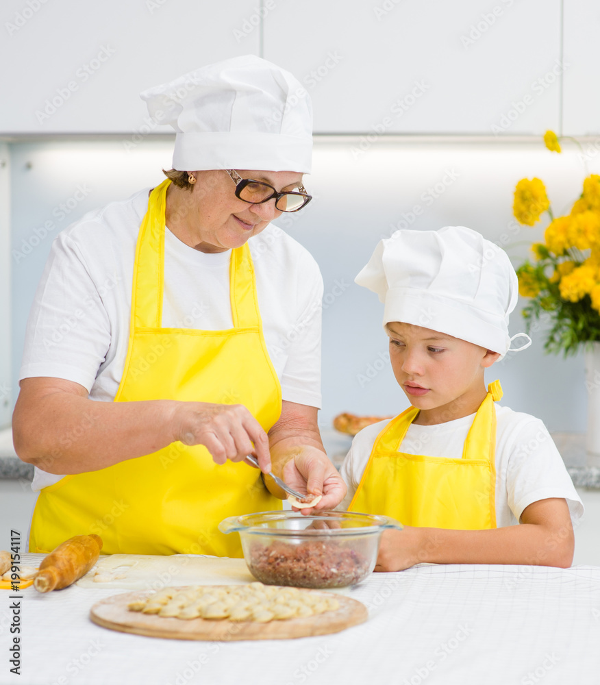 grandmother teaches her grandson to make a dumplings grandmother teaches her grandson to make a dumplings