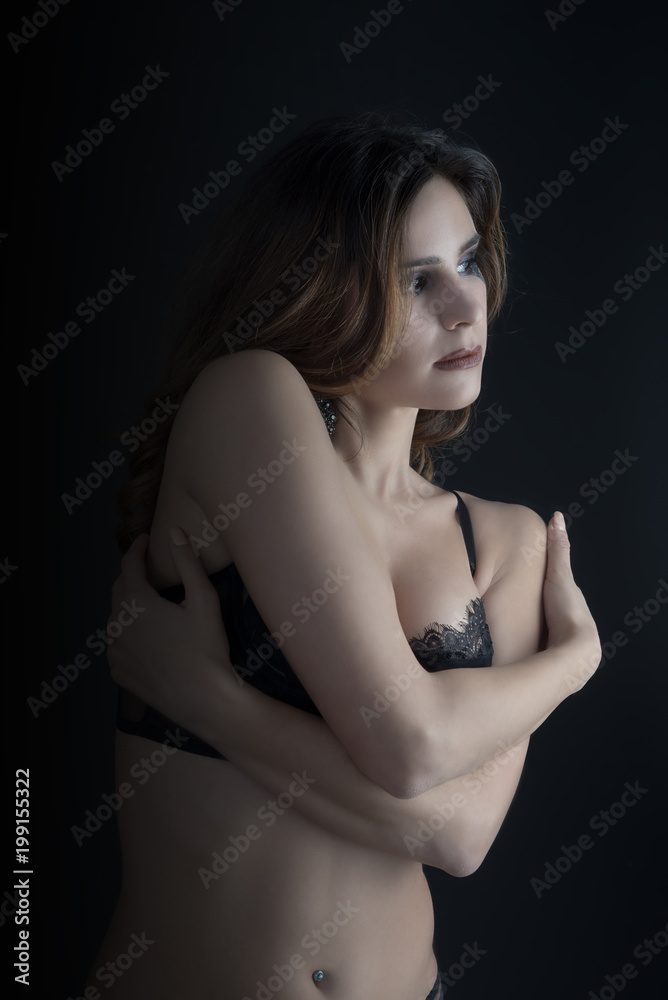 cute girl posing on dark background cute girl posing on dark background