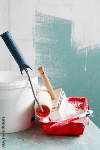 Roller Painting Container and the Painting Roller. photo