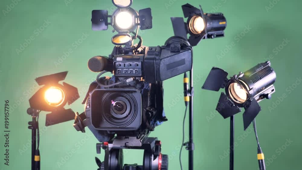 Video equipment set with a turning camcorder in the center Video equipment set with a turning camcorder in the center
