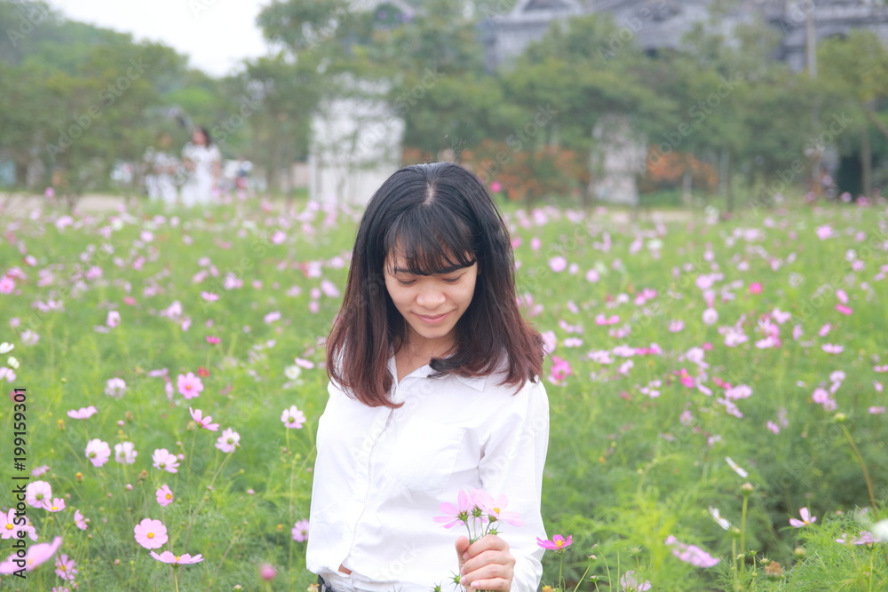 woman at the flower garden in Hanoi, Vietnam woman at the flower garden in Hanoi, Vietnam