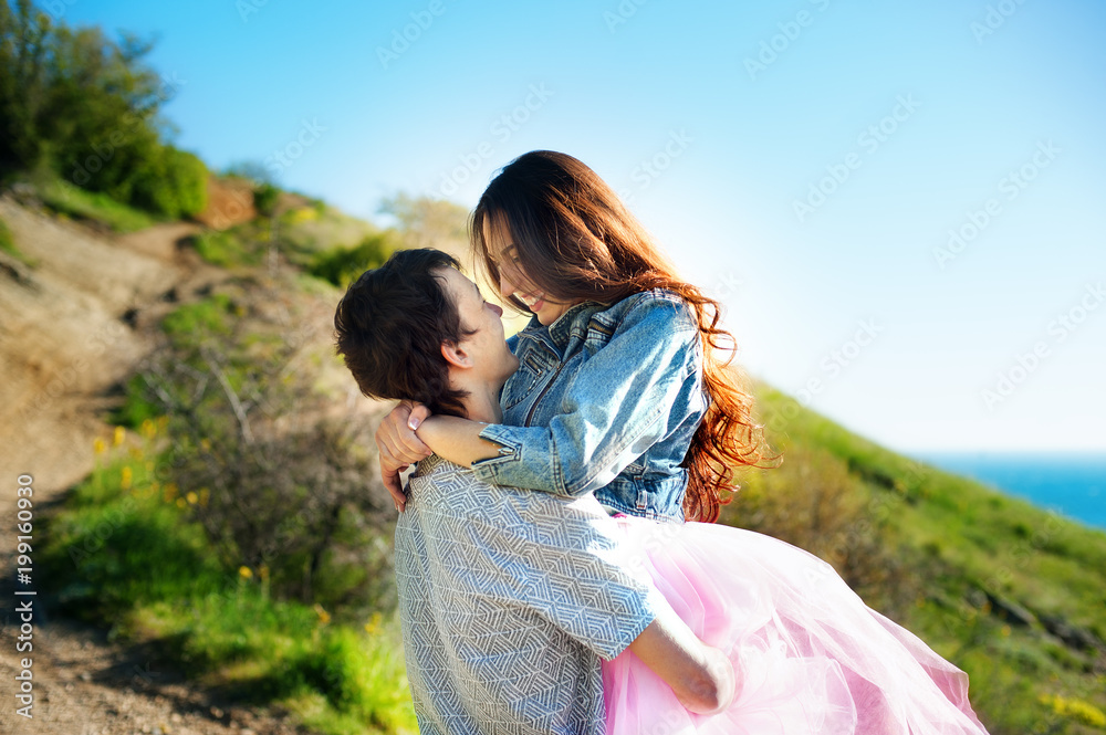 Loving couple has beautiful moments of happiness and joy by the sea. Love and tenderness.Lifestyle concept Loving couple has beautiful moments of happiness and joy by the sea. Love and tenderness.Lifestyle concept