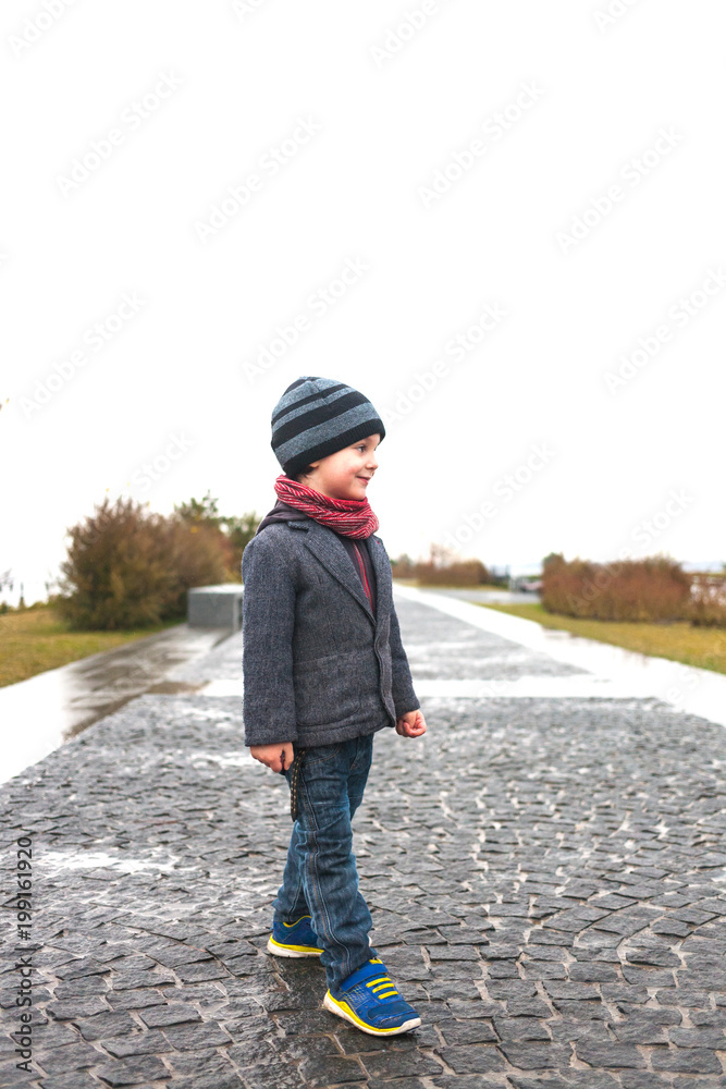Fototapeta premium The boy is on a walk.