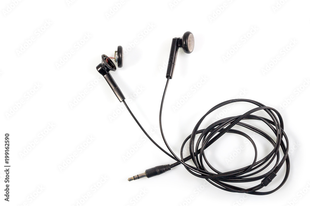 Top view of broken old black earphones or headphones on white background. Top view of broken old black earphones or headphones on white background.
