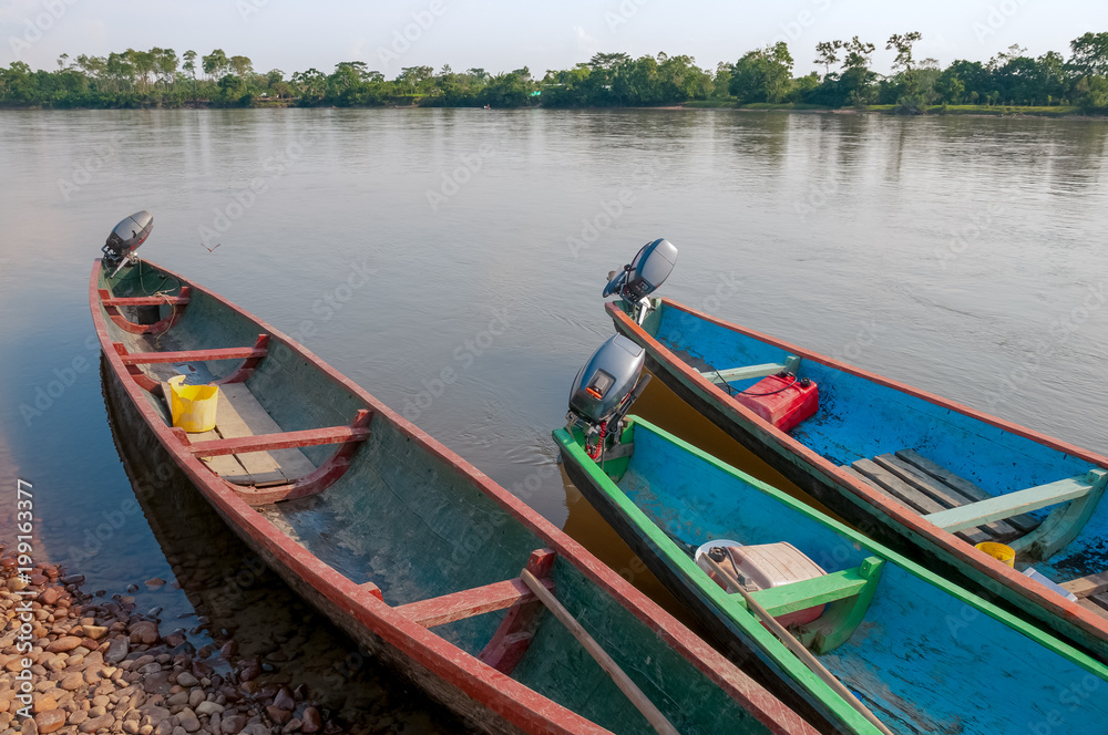 canoe propelled by motor in colombia river