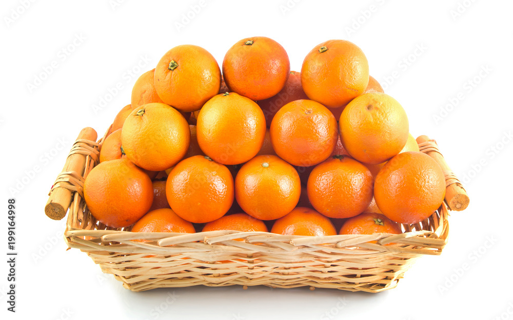 Fresh orange, organic ripe mandarins, pile of orange in wood basket on white background with clipping path.