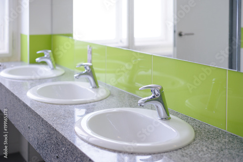 Bathroom interior with white sink and faucet