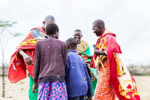 Massai tribe family celebrating and dancing