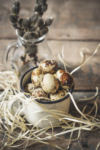 quail eggs on a wooden surface (a bunch of quail eggs)