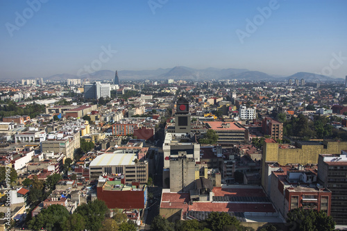 Aerial view of a neighborhood called Colonia Juarez in Mexico City  Mexico  on a sunny morning with some haze.