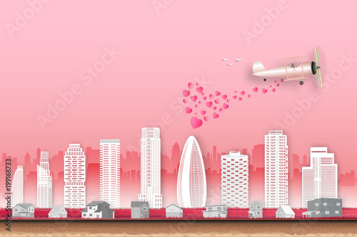 Heart from aircraft and cityscape on pink sky as love, happy valentine's day, wedding, paper art and craft style concept. vector illustration.
