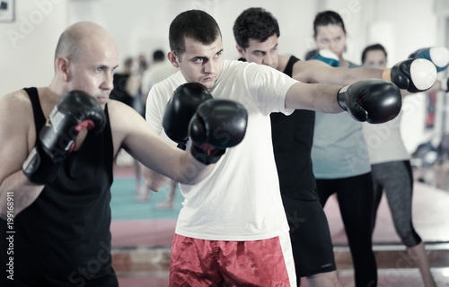 Portrait of men training at sparring together