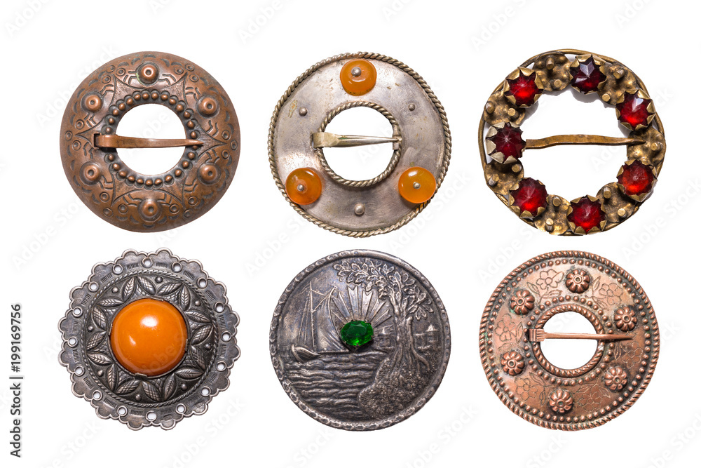 Fototapeta premium Set of antique metal Latvian national style brooches, Izolate