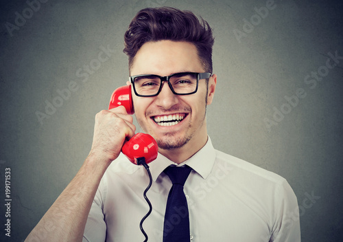 Cheerful businessman speaking on the phone