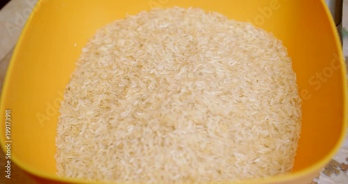 Rice is poured into a bowl