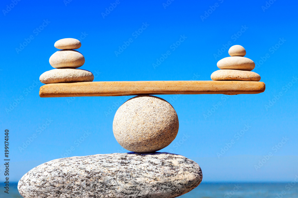 Concept of harmony and balance. Balance stones against the sea. Stock Photo