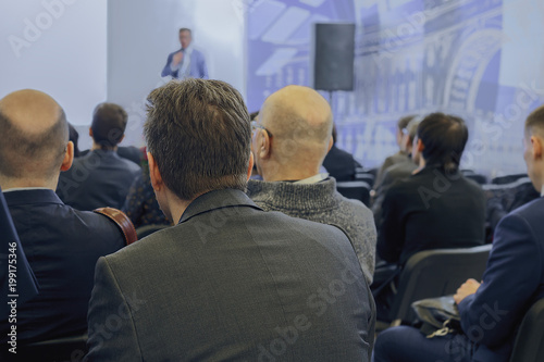 rear view of a man attending a business conference